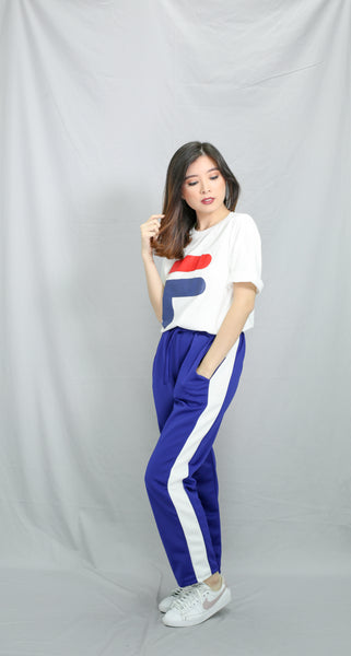 Royal blue track pants with white strip
