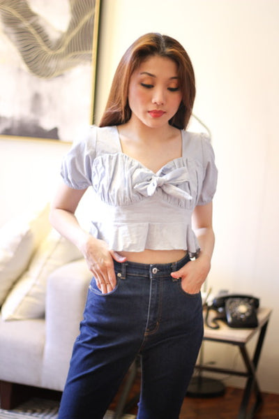 Light blue top with ribbon